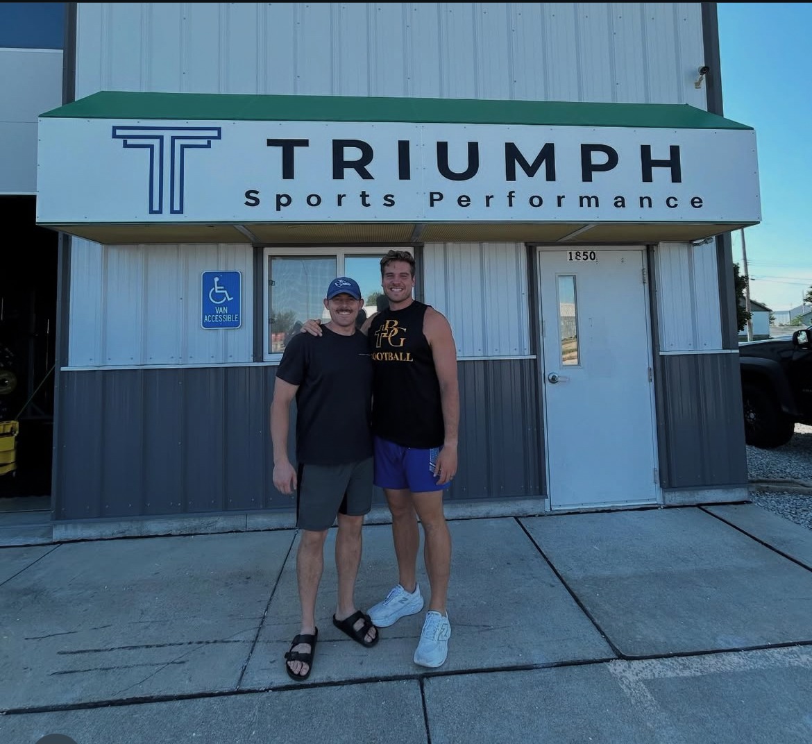 Triumph athletes outside the training facility